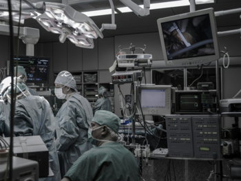 people wearing surgical clothes inside operating room